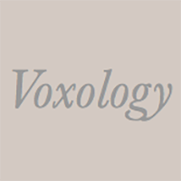 A peach box with the words "Voxology" in it